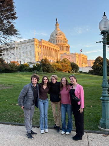 Group of 5 posing outside of United States Capitol Building