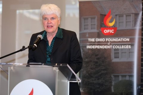 Pam Hershberger speaking at the podium