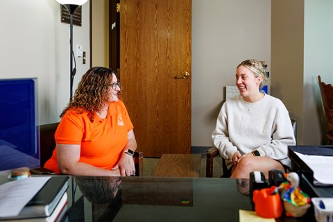 Reverend Brandi Grant-Rigsby, Director of Religious and Spiritual Life and University Chaplain at Ohio Northern University chatting with a student