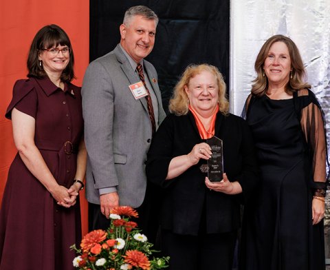 Karen Kier being presented with her Distinguished Alumni Award
