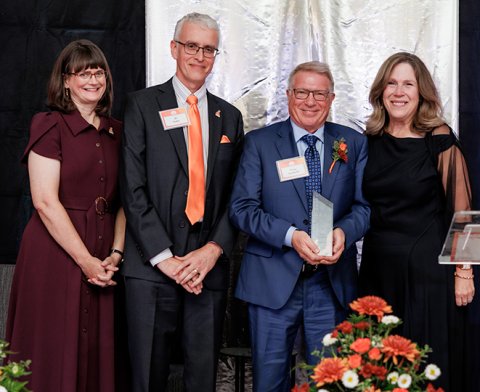 Doug Leuthold being presented with his Distinguished Alumni Award
