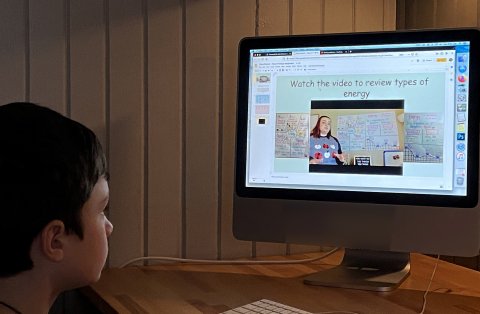 Student watching an online video lesson