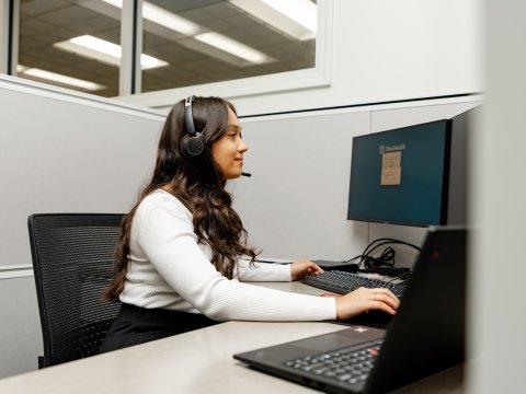 Photo of Jenny working on a computer
