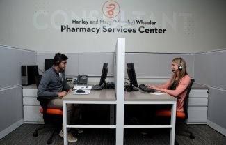 Pharmacy students work at the Pharmacy Services Center