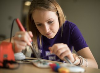 Student working on toy adaptation project