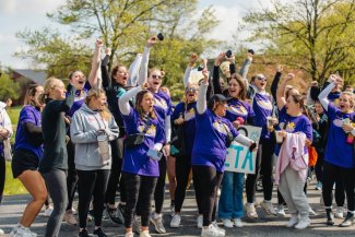 Sorority members cheer during an activity.