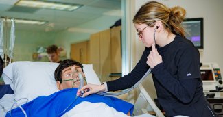 Photo of ONU Nursing student working on a mannequin