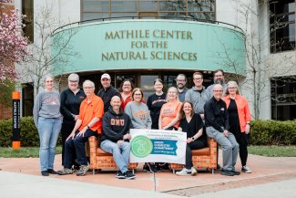 Chemistry faculty and staff posing for green commitment photo