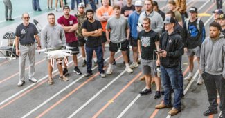 Photo of ONU students and staff flying a drone