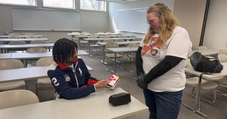 Photo of ONU Pharmacy students holding a box or Narcan