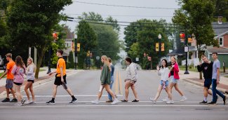 Photo of ONU students walking downtown - crossing the street