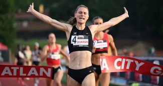 Photo of Emily crossing a finish line. Photo courtesy of Adidas Atlantic City Games