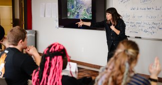 Photo of Emily teaching a class