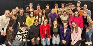 Musical theater group posing together