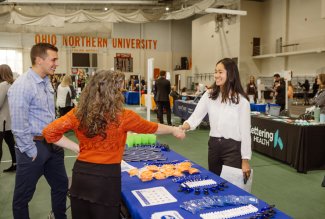 A soon-to-be graduate meeting a potential employer at Ohio Northern University's 2022 Career Fair.