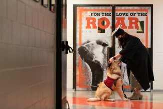 An Ohio Northern University graduate with a service dog she trained.