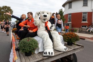 Ohio Northern University's Klondike mascot riding a 2021 Homecoming Parade float.