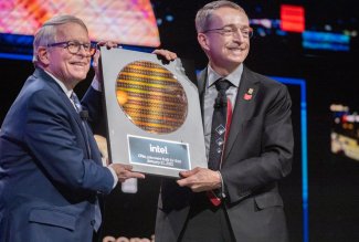 Ohio Gov. Mike DeWine accepts a silicon wafer from Intel CEO Pat Gelsinger.