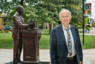 ONU alumni Jerry Johnson next to MLK statue