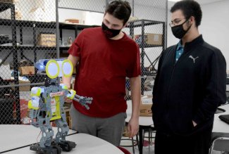 Lima Senior High School students working on a robot.