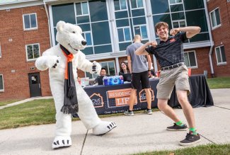 Ohio Northern University's Klondike with a student on move-in day.