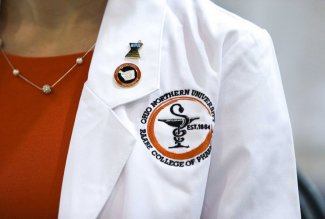 Close-up of white coat worn by an Ohio Northern University pharmacy faculty member.