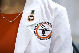 Close-up of an Ohio Northern University College of Pharmacy white coat.