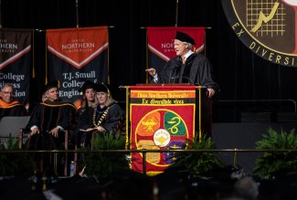 Mike Prescott, regional group manager for U.S. Bank, speaking at Ohio Northern University's 2023 commencement ceremony.