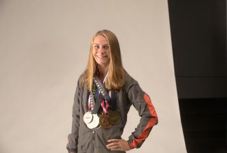 Emily Richards with NCAA and All-American Academic medals she earned while a student at Ohio Northern University.