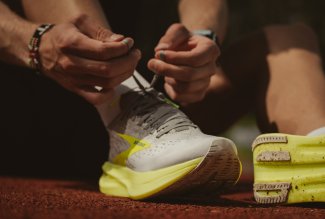 Photo of person tying running shoes, by Malik Skydsgard, courtesty of Unsplash.