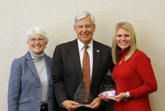 Ohio Northern University President Dan DiBiasio, his wife Chris Burns-DiBiasio and '97 alum Arlene Allison received awards.