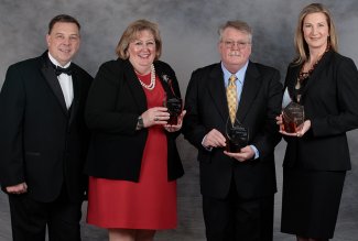 From left are John C. Navin, dean of ONU’s Dicke College of Business Administration; and Pinnacle Award recipients Deann Fishpaw Newman; Jerry Davis, accepting on behalf of his late wife, Judy (Monastra) Davis; and Anmarie (Gladieux) Kolinski.