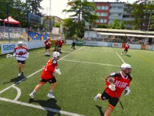 Front row photo of a lacrosse match