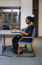 Photo of Maria at a desk