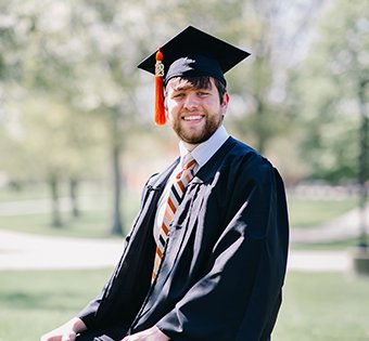 A photo of Matthew in his cap and gown