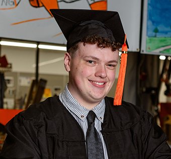 Photo of Kaden in his graduation cap and gown