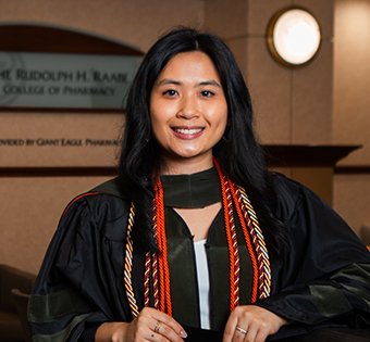 Photo of Brianna in her graduation Gown