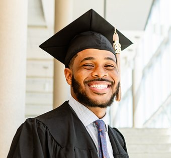 Photo of John in his graduation cap
