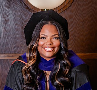 Photo of Aleeia in her graduation garb