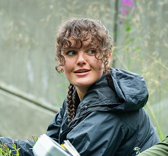 Photo of Elizabeth out in the field